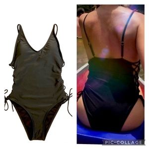Black tie lace up sides plunge one piece swimsuit. High cut, cheeky, adjustable